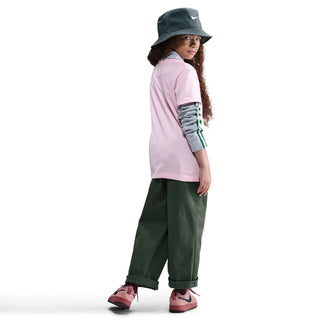 Youth pink tee side view with small Nike logo on chest