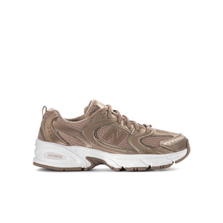Youth running shoes in taupe and light brown with ABZORB logo, lace-up design.