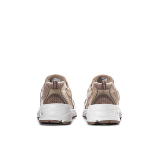 Youth sneaker pair from heel: taupe upper with white midsole and cushioned back.