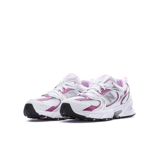 Youth sneakers in white with pink and lavender details, side view