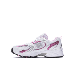 Youth sneakers in white with pink and lavender panels, angled side view