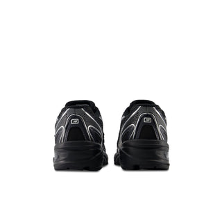 Youth New Balance sneakers, black heel view with cushioned collar and lace-up closure