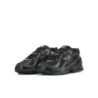 Youth black running shoes, angled front view with mesh upper