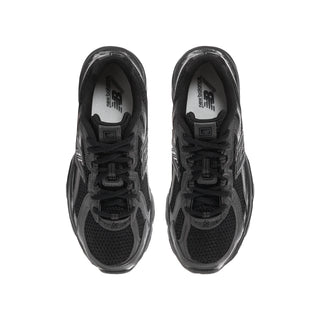 Youth black running shoes, lace-up tongue and gray-lined interior