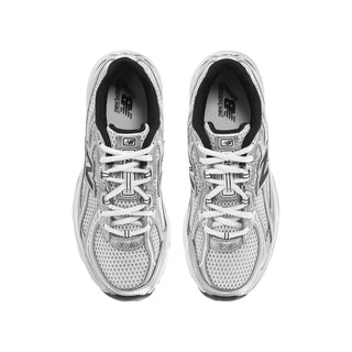 Youth sneaker pair, silver laced uppers with black lining and N logos