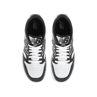 Youth black and white sneaker with '480' and New Balance branding on tongue
