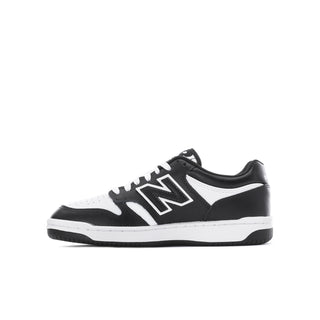 Youth black/white low-top sneaker with lace-up eyelets and New Balance N logo