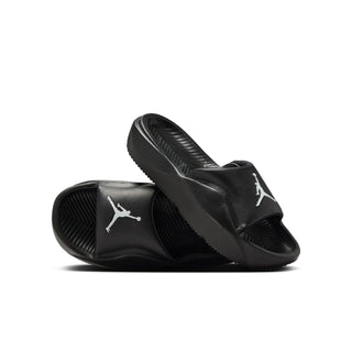 Youth black slide sandals, pair view, with Jumpman logo and textured footbed
