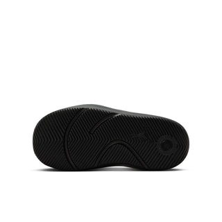 Youth black slide sandal outsole with textured traction pattern and circular logo mark