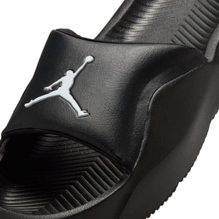 Youth black slide sandal close-up of textured strap and white Jumpman logo