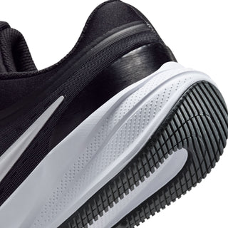 Youth black and white sole tread detail with side cushioning and traction lugs