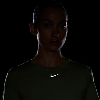 Dark performance tee with Nike logo; twisted front seam detail