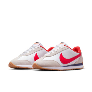 Women's low-top sneakers, white uppers with red swoosh, blue side stripe, gum sole