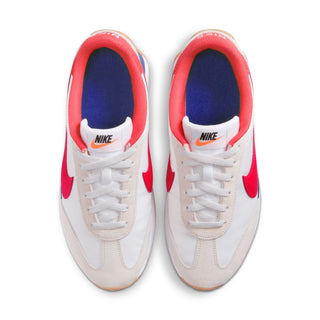 Women's low-top sneakers back view: white leather with red collar, blue lining