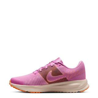 Pink running shoe with Nike swoosh on side and orange-and-cream rubber sole