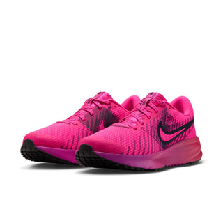 Women's pink lace-up running shoes with black Swoosh and cushioned midsole