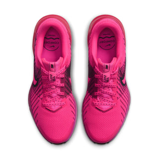 Women’s running shoes in hot pink with black accents, lace-up athletic style