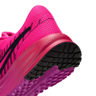 Women's pink running shoe outsole tread with curved midsole and black accents