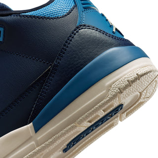 Kids high-top sneaker side close-up in navy with blue stripe and white sole