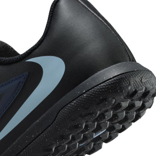 Youth soccer shoe side view detail with black knit upper and studded rubber outsole