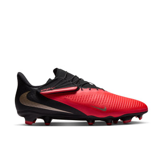 Men's low-cut FG soccer cleat in bright red and black with studded outsole