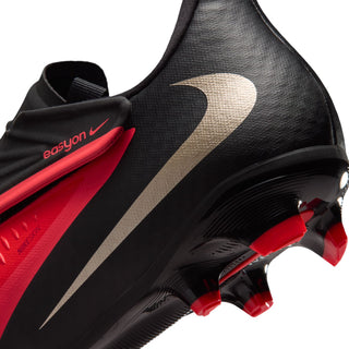 Close-up of men's FG cleat heel and midfoot in black with gold stripe and red trim