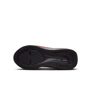 Youth running shoe outsole with black tread and contoured sole.