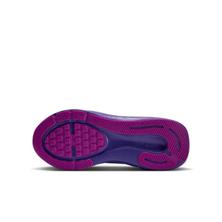 Youth running shoe outsole with purple tread and textured grip zones