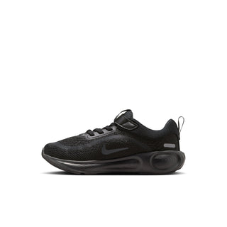 Side view of a black kids' Nike running shoe with mesh upper and sculpted sole