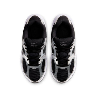Pair of Nike youth sneakers showing black interior lining and lace-up forefoot