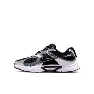 Nike youth running shoe side view in black and silver with textured toe and swoosh