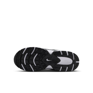 Outsole tread of Nike youth sneakers with dark rubber traction pods
