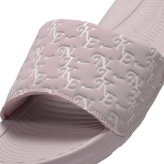 Close-up of mauve-pink slide sandal strap with embossed logo pattern and cushioned lining