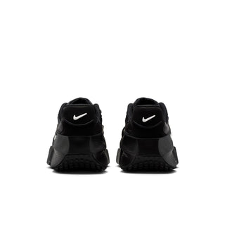 Black womens running shoe, rear view with Nike swoosh and grippy tread