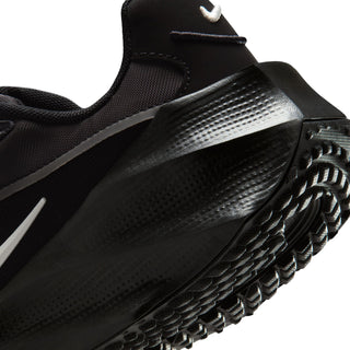 Close-up of black womens running shoe side with Nike details and patterned sole edge