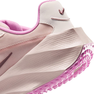Close-up of light pink sneaker midsole and purple outsole with raised pattern