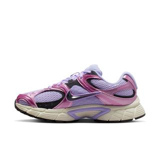 Women’s athletic running shoe side profile in lavender purple with pink overlays and swoosh