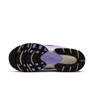 Women’s running shoe outsole with black and purple traction pattern and cream midsole
