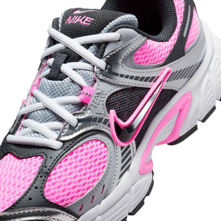 Women's sneaker upper close-up, gray mesh with black collar and pink Nike swoosh.