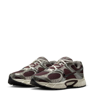 Women's running shoes in burgundy and gray knit uppers with lace-up closure and chunky sole