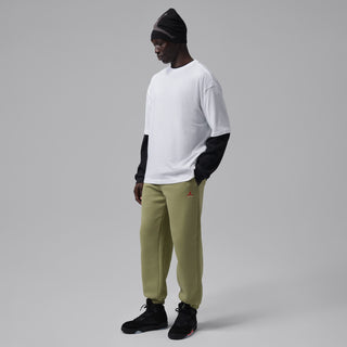 Men's black lace-up high-top sneakers worn with white shirt and olive pants