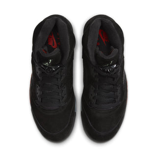Pair of black high-top sneakers with red logo on interior lining