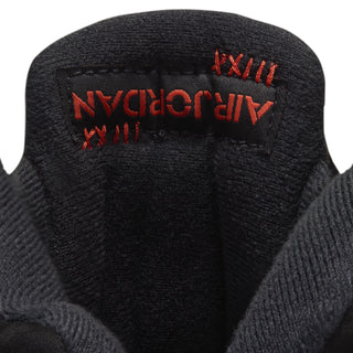 Black sneaker tongue lining with red Nike Air graphic