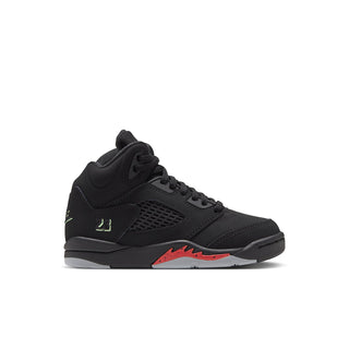 Black kids sneakers with lace-up front, mesh side panel, green logo, red accent on sole