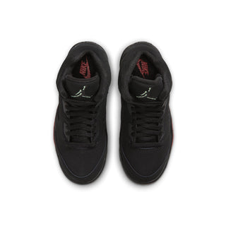 Black kids low-top sneakers from above, lace-up closure with red and green tongue logo