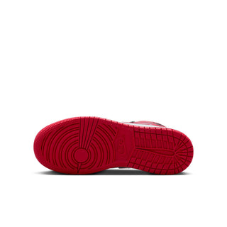 Youth sneaker outsole in red with patterned tread and circular traction design