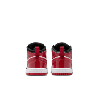 Kids mid-top sneakers back view with red heel tabs and white midsoles