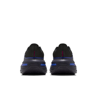 Women’s black running shoes with blue heel stripe and small pink pull tab
