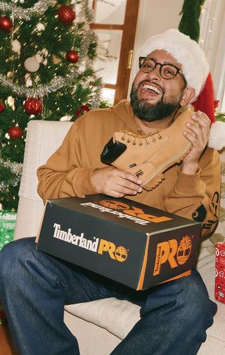 Male posing with Timberland gift