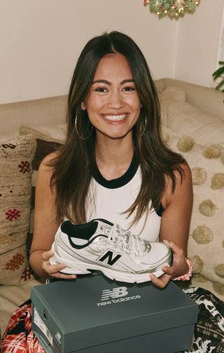 Women posing with New Balance Shoe gift